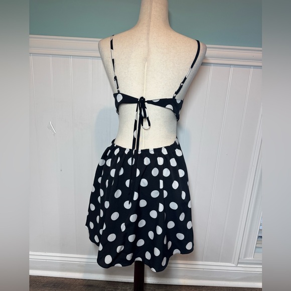 Vici Black Dress with White Polka Dots and Front Cutout - Picture 11 of 15
